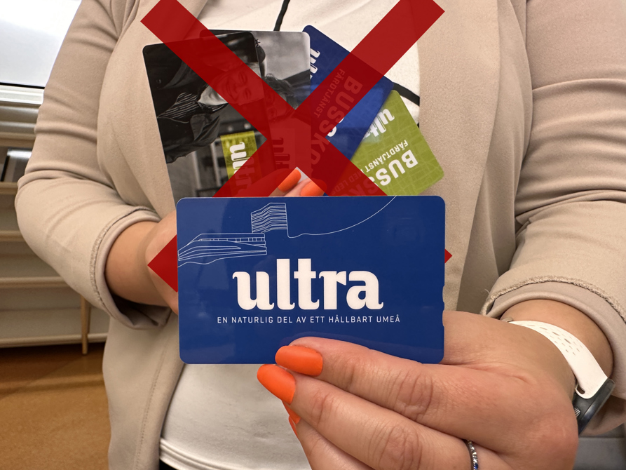 Woman showing new bus card, old cards crossed out