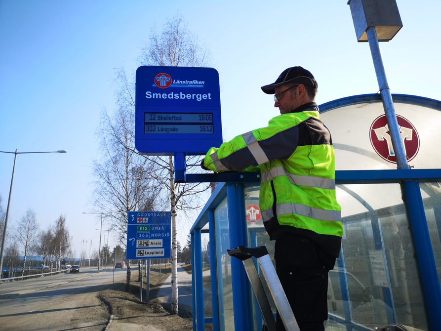Digital sign is being installed at a bus stop